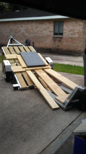 I decided to lift front of trailer and jam three 2x4's, just one was not enough, and I also jammed the tires, it felt solid enough to start removing the wooden frame i built around the plate for transport.